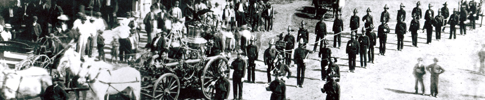 A historic photograph of the LAFD with horse-drawn vehicles